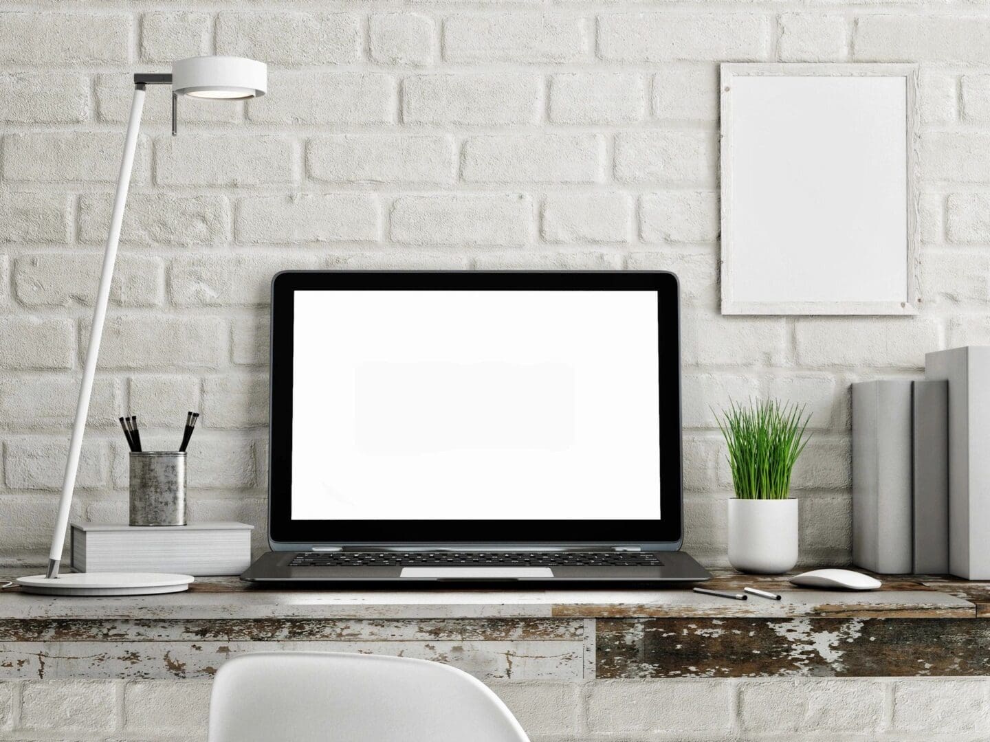 A laptop sitting on top of a desk.